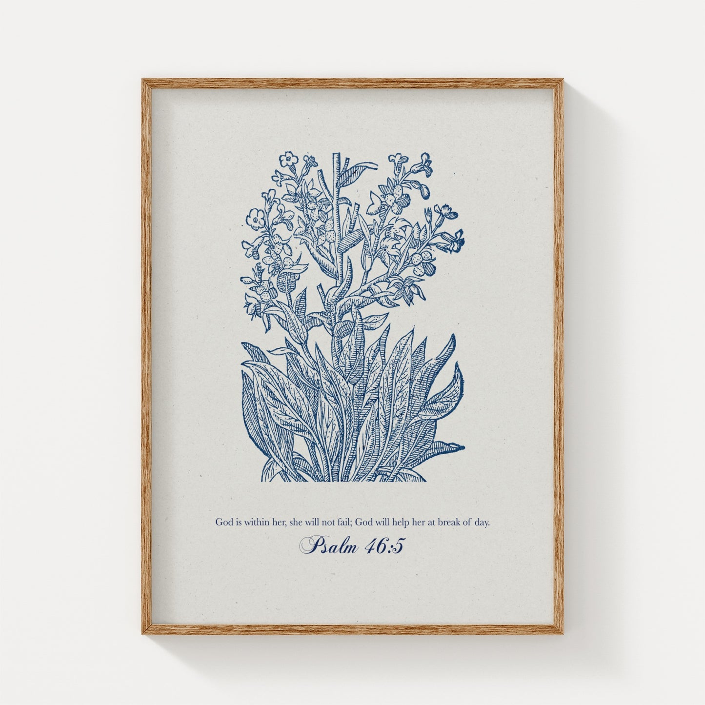 Botanical art print featuring delicate blue floral illustrations paired with the Bible verse Psalm 46:5, displayed in a natural wood frame on a light background.