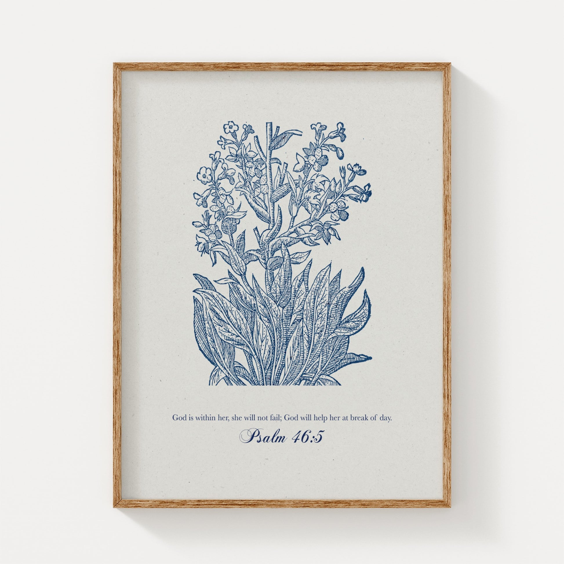 Botanical art print featuring delicate blue floral illustrations paired with the Bible verse Psalm 46:5, displayed in a natural wood frame on a light background.