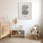 Psalm 46:5 art print with delicate black floral details, styled in a nursery with soft neutral tones, a wooden crib, and plush toys for a cozy ambiance.
