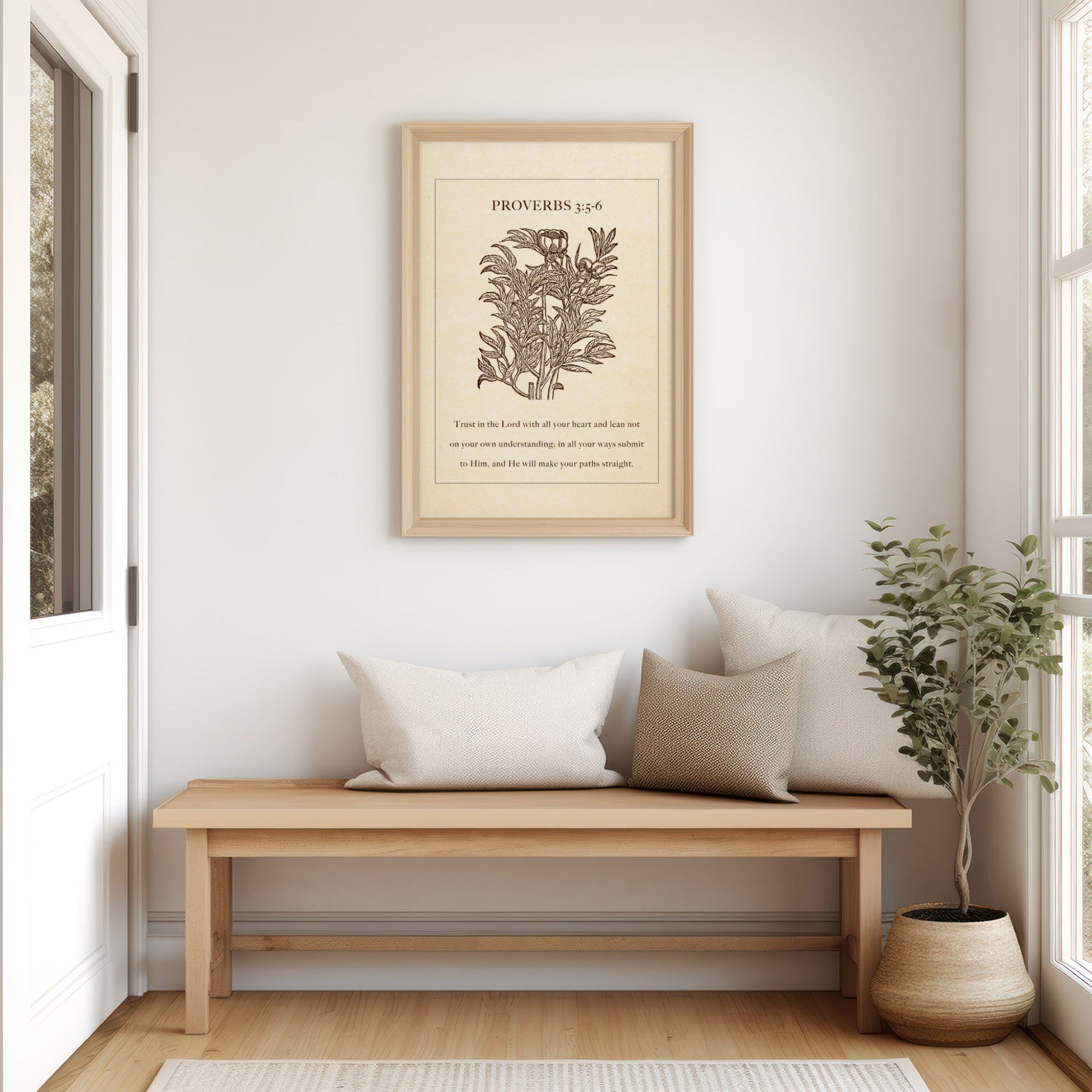 Proverbs 3:5-6 botanical art print styled above a wooden bench with neutral pillows and a potted plant, creating a serene and welcoming entryway.