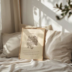 Isaiah 41:10 botanical art print styled on a cozy bed with neutral, textured pillows and soft lighting, surrounded by gentle shadows from sunlight streaming through a nearby window.