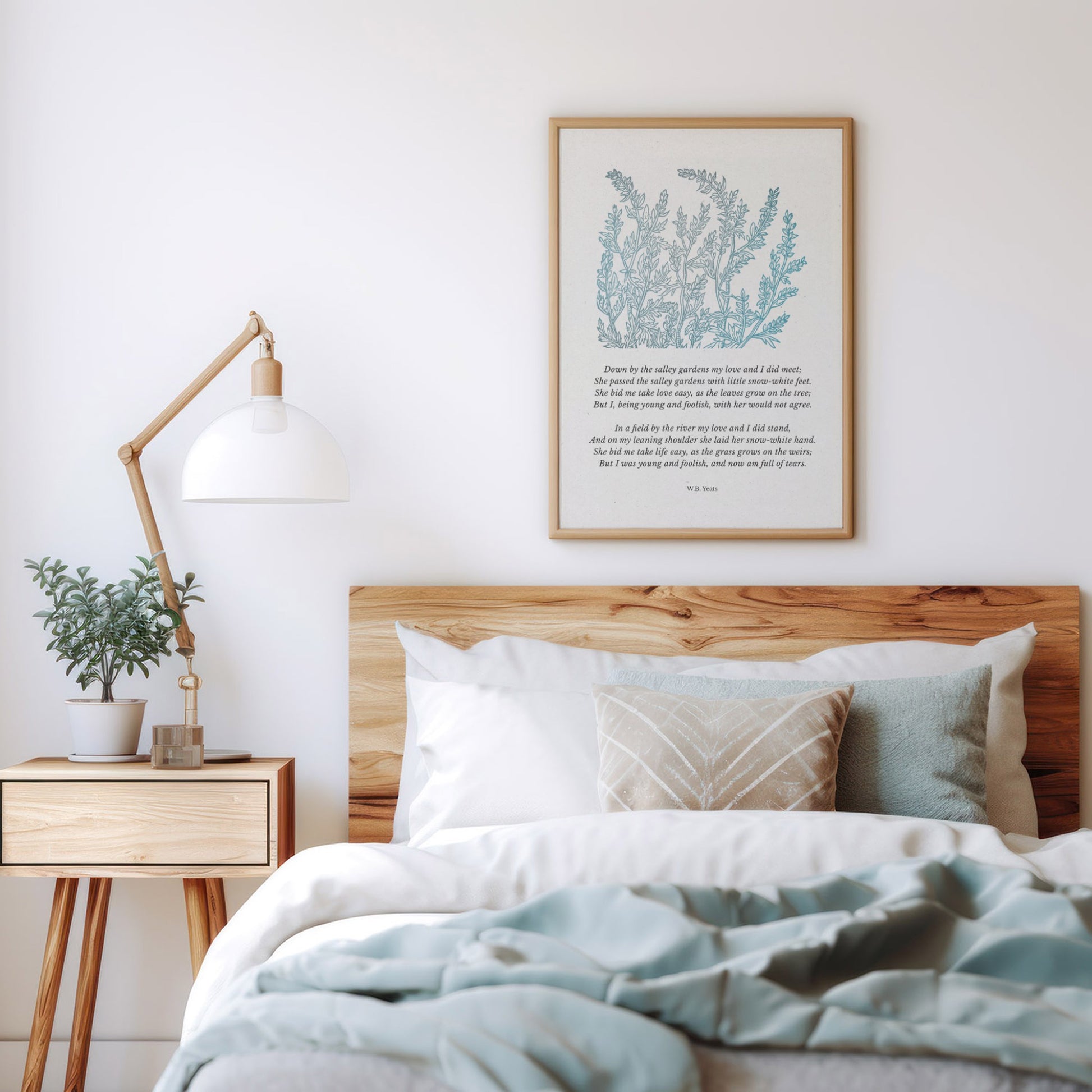 A cozy bedroom display with the framed Yeats poem print hanging above a wooden bed, surrounded by light and calming decor for a serene atmosphere.