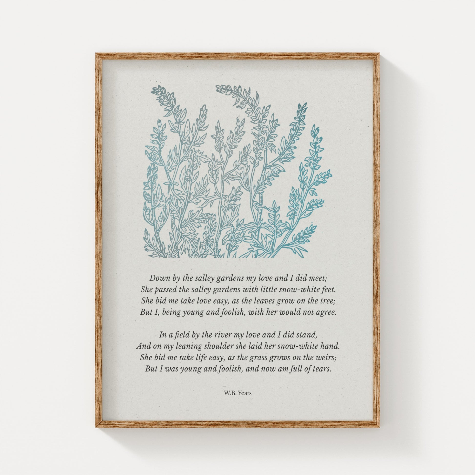 A vintage-inspired art print featuring W.B. Yeats’ poem “Down by the Salley Gardens,” paired with soft blue botanical illustrations, elegantly framed in natural wood on a neutral background.