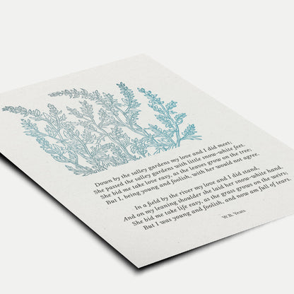 A close-up view of the art print laid flat, highlighting the detailed botanical illustration and timeless typography of the Yeats poem.