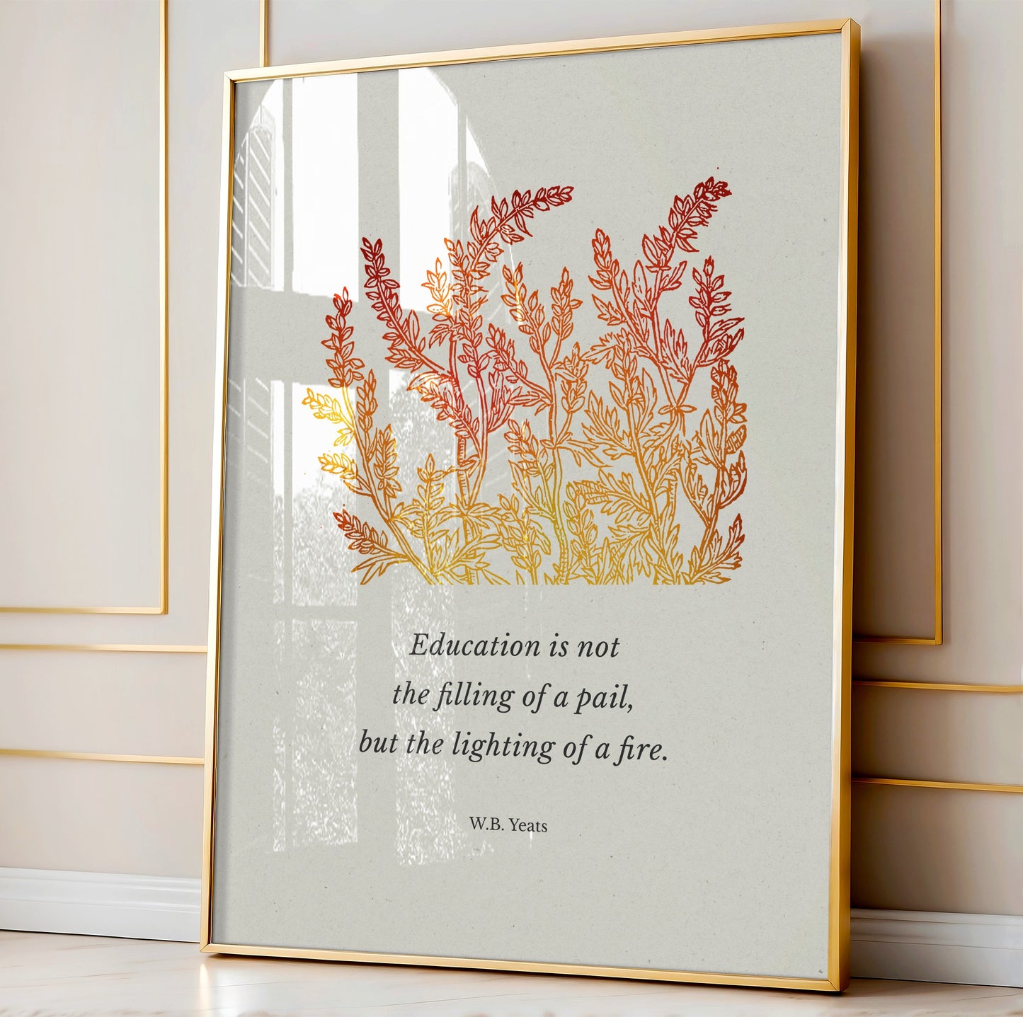 The print in a stylish setting with a reflective glass finish and golden accents, leaning against a wall in a bright and sophisticated interior.