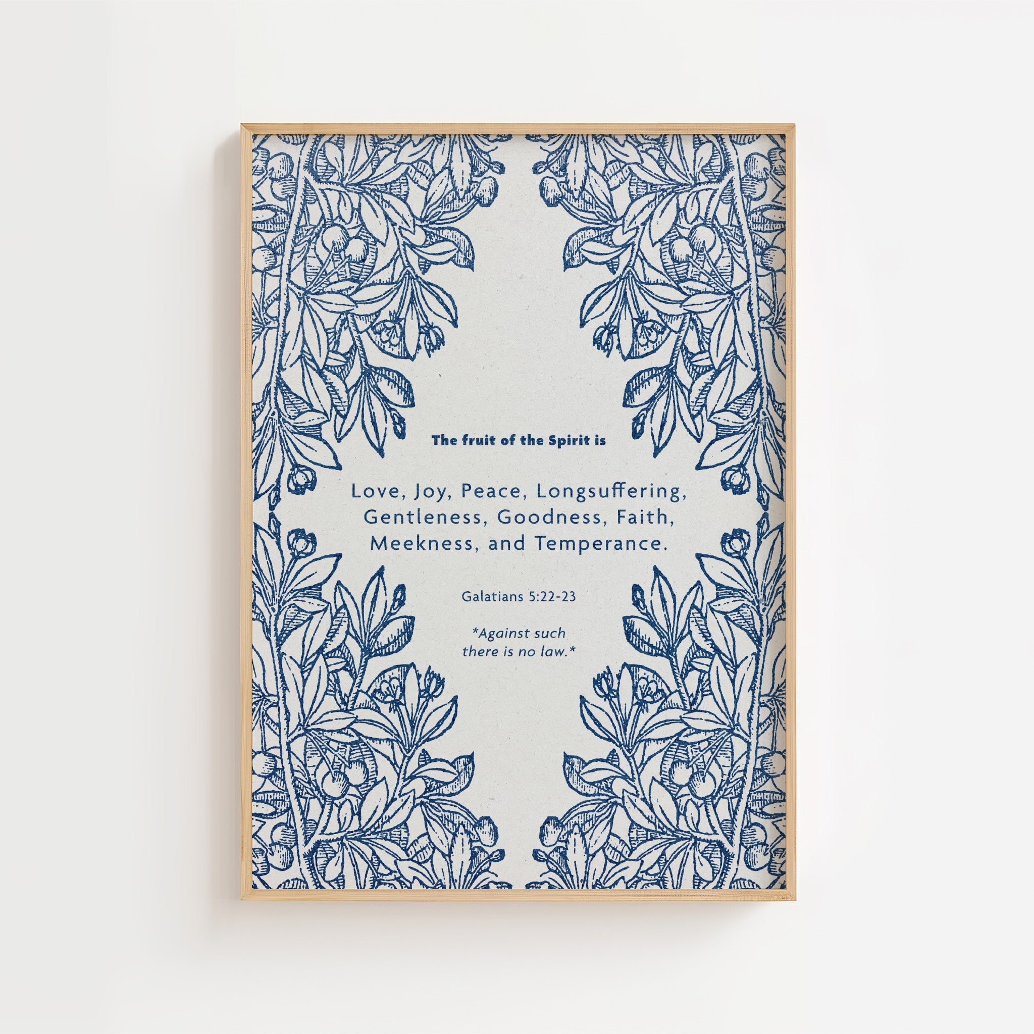 Framed fruit of the Spirit artwork with blue floral design and text on a white background