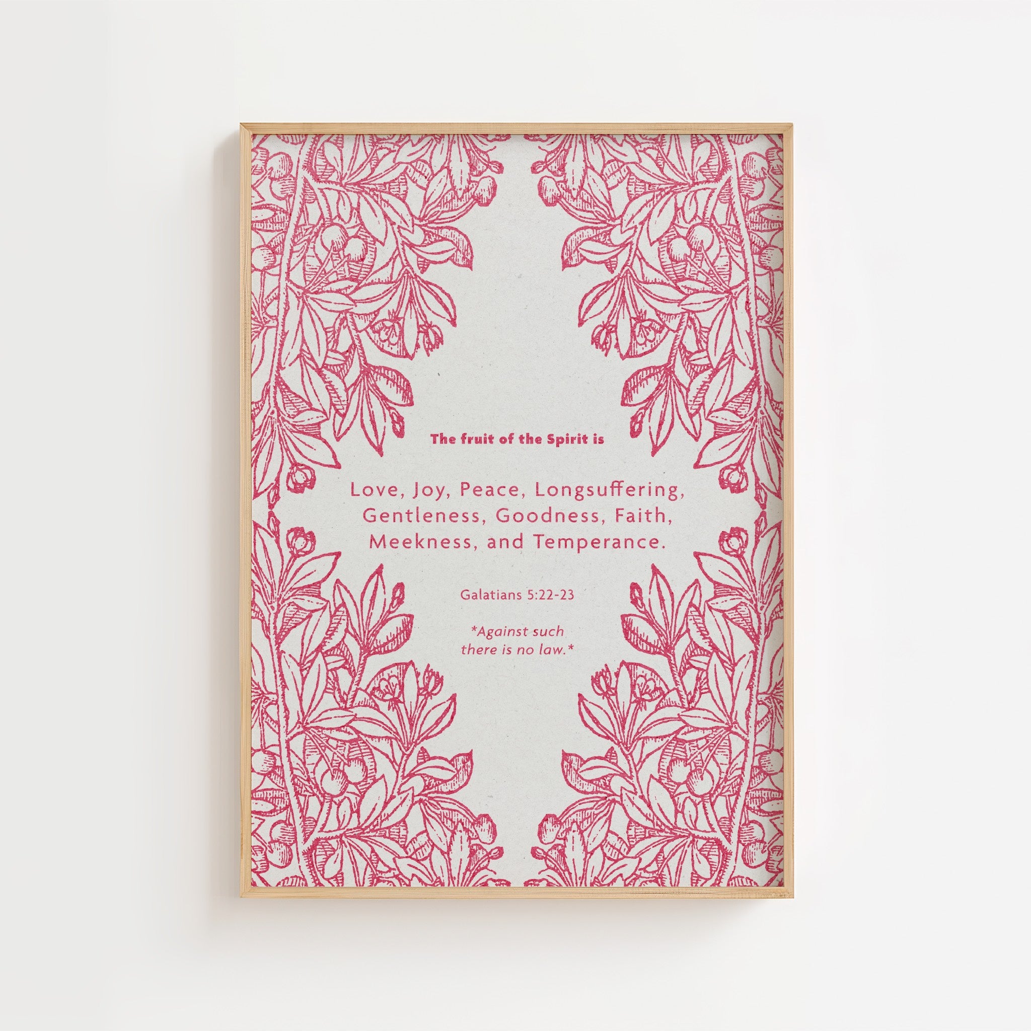 Framed fruit of the Spirit artwork with pink floral design and text on a white background