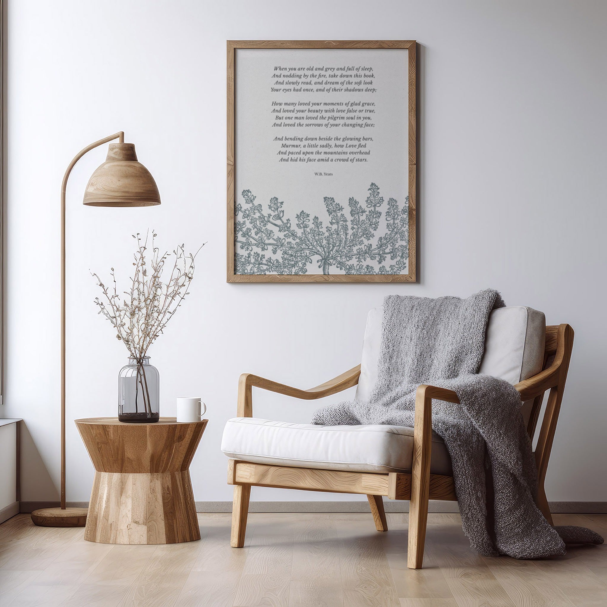 A minimalistic living space with a reading chair and lamp, featuring the framed “When You Are Old” print, complementing the warm and peaceful decor.