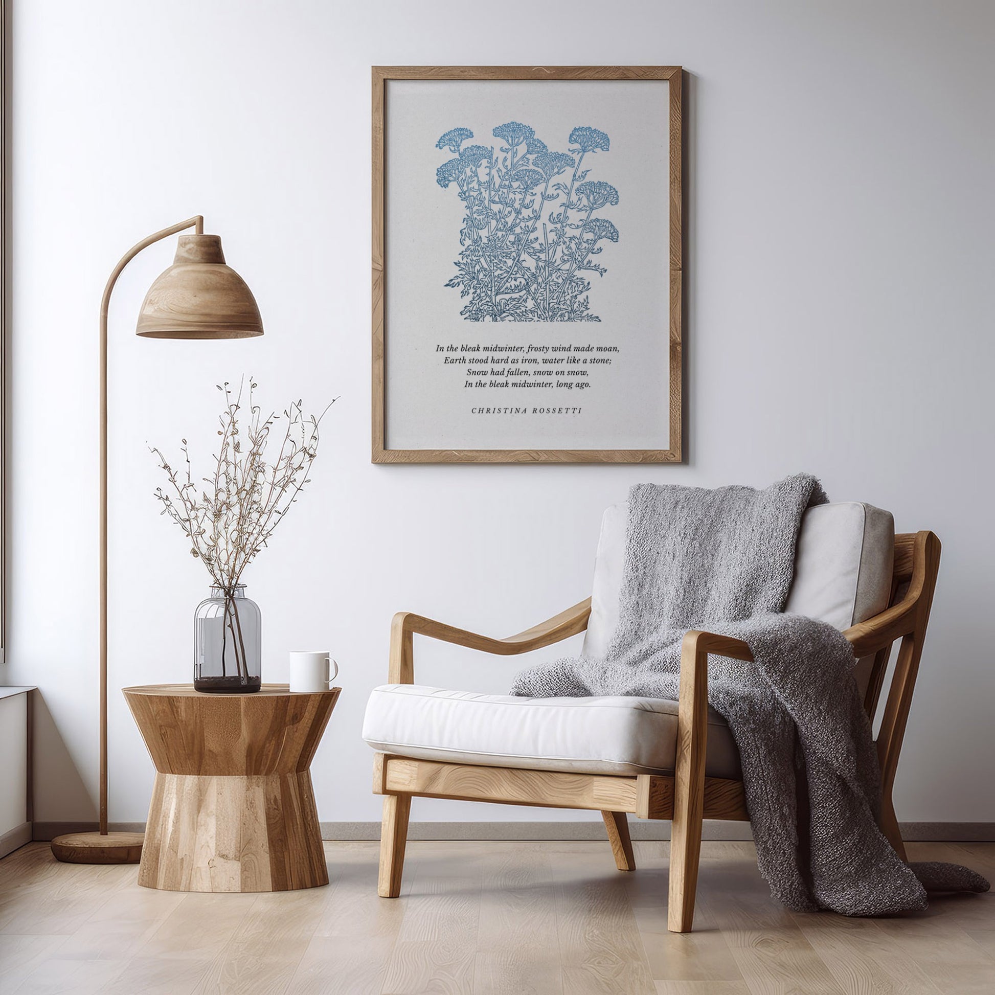 Botanical art print featuring blue wildflowers and a quote by Christian Rossetti, styled in a serene living room with a natural wood chair, side table, and vase of branches.