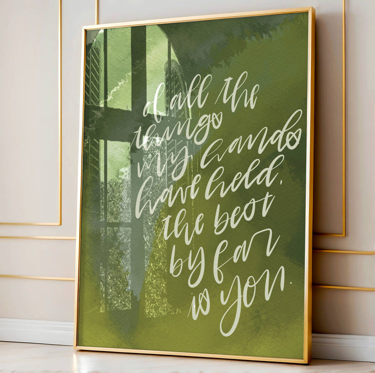 Framed artwork with motivational quote on a green background