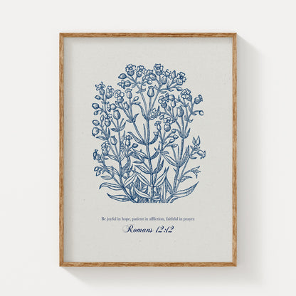 Botanical art print featuring delicate blue floral illustrations paired with the Bible verse Romans 12:12, displayed in a natural wood frame on a light background.