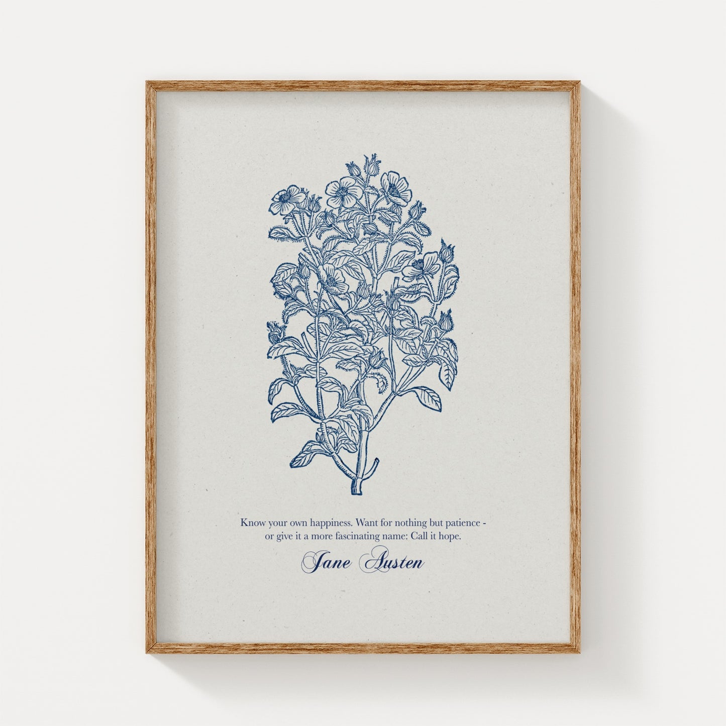 Minimalist botanical art print showcasing blue floral illustrations and a Jane Austen quote, framed in natural wood and displayed on a plain white background.