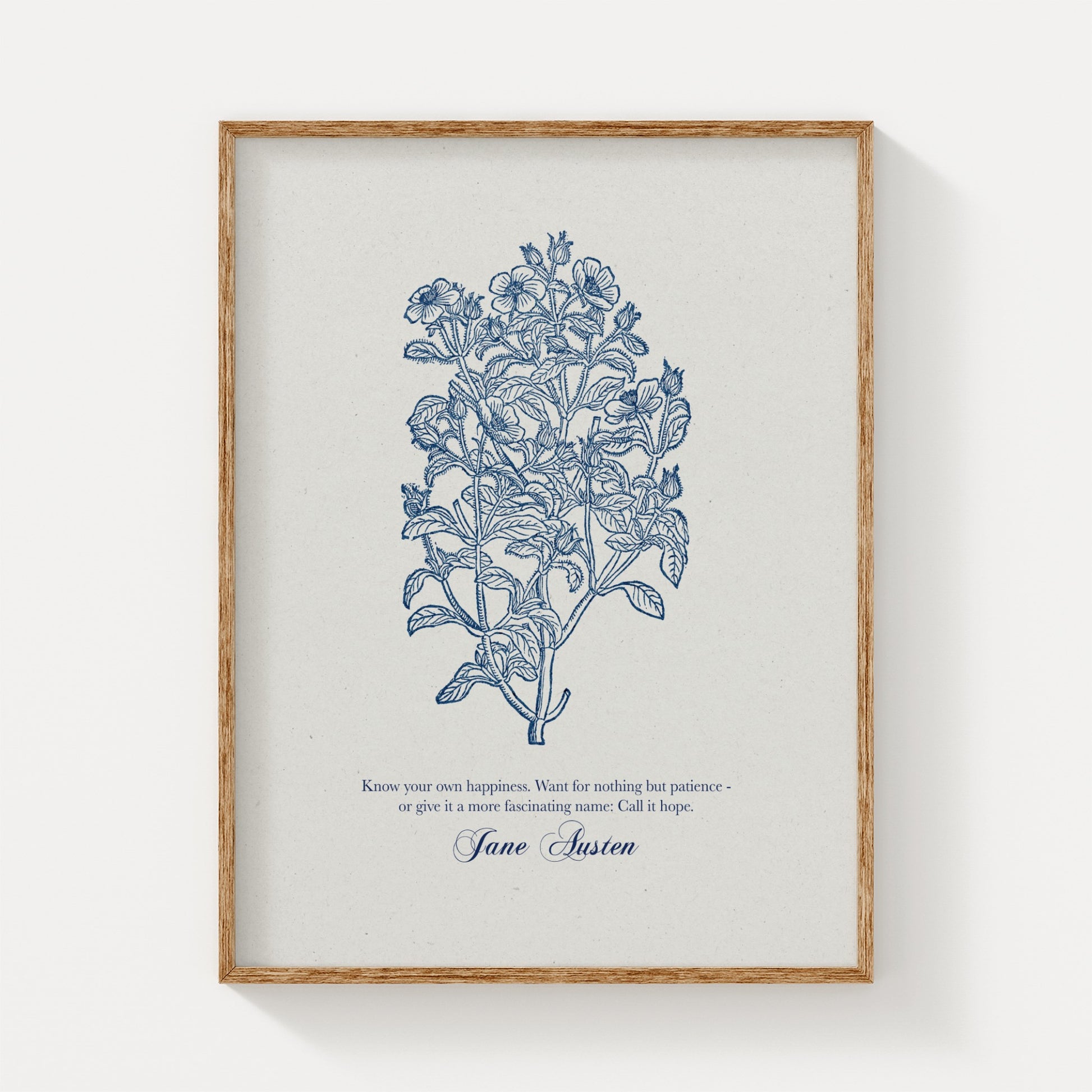 Minimalist botanical art print showcasing blue floral illustrations and a Jane Austen quote, framed in natural wood and displayed on a plain white background.