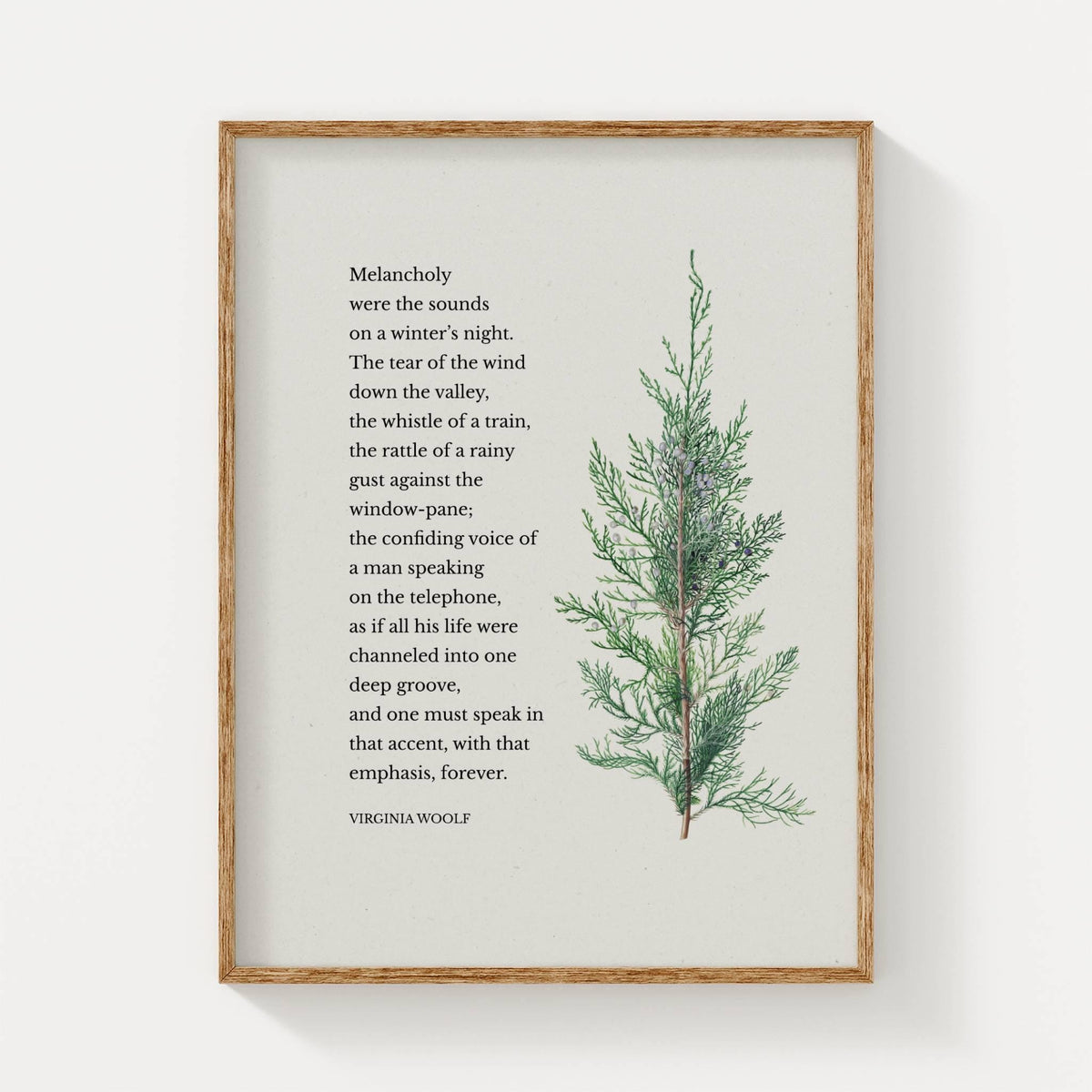 Framed print with nature-themed quote by Virginia Woolf and a plant illustration on a paper background